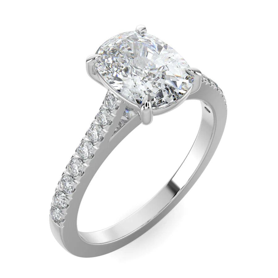 Angled view of a silver solitaire lab diamond engagement ring featuring an oval cut diamond in four-prong setting.