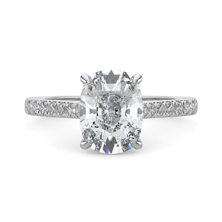 Top view of a silver lab diamond ring featuring small diamonds on the band and a larger central diamond of oval shape in four prong setting.