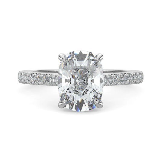 Top view of a silver lab diamond ring featuring small diamonds on the band and a larger central diamond of oval shape in four prong setting.