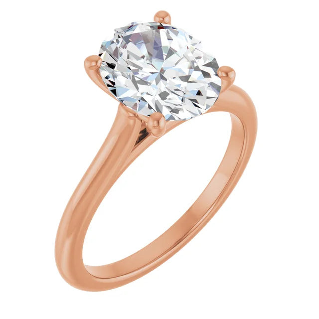 Angled top view of a rose gold engagement ring showcasing a round white diamond centerpiece secured by 4 prongs, with a sleek and polished band.