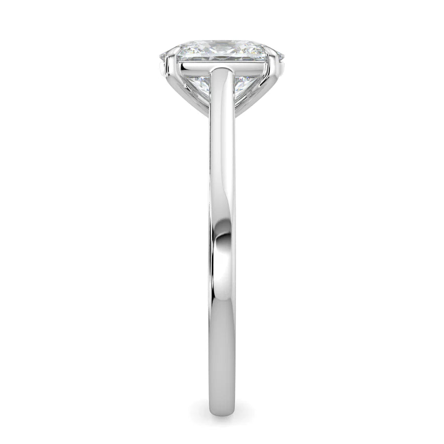 Side view of a silver color solitaire lab diamond engagement ring featuring a round cut diamond in color four-prong setting.