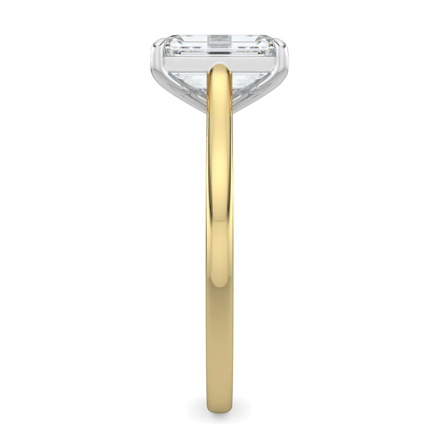 Side view of a gold lab grown diamond ring with radiant-cut diamond in a four-prong setting and silver color polished band.