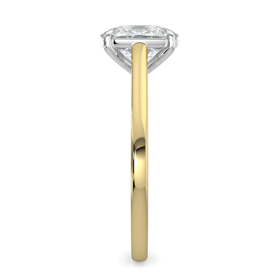 Side view of a gold solitaire lab diamond engagement ring featuring a round cut diamond in silver color four-prong setting.