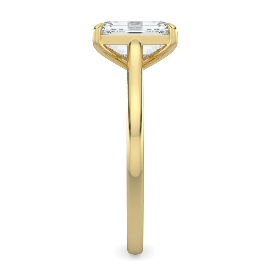 Side view of a gold lab grown diamond ring with radiant-cut diamond in a four-prong setting and gold color polished band.