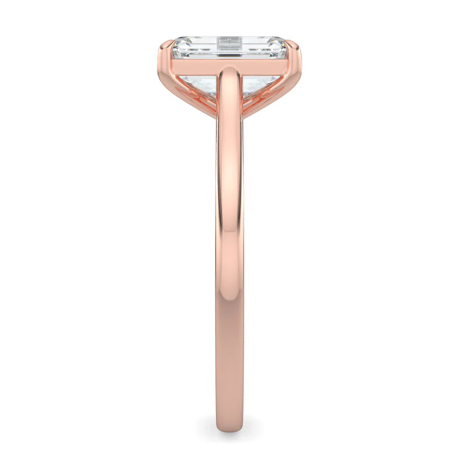 Side view of a rose gold lab grown diamond ring with radiant-cut diamond in a four-prong setting and rose gold color polished band.