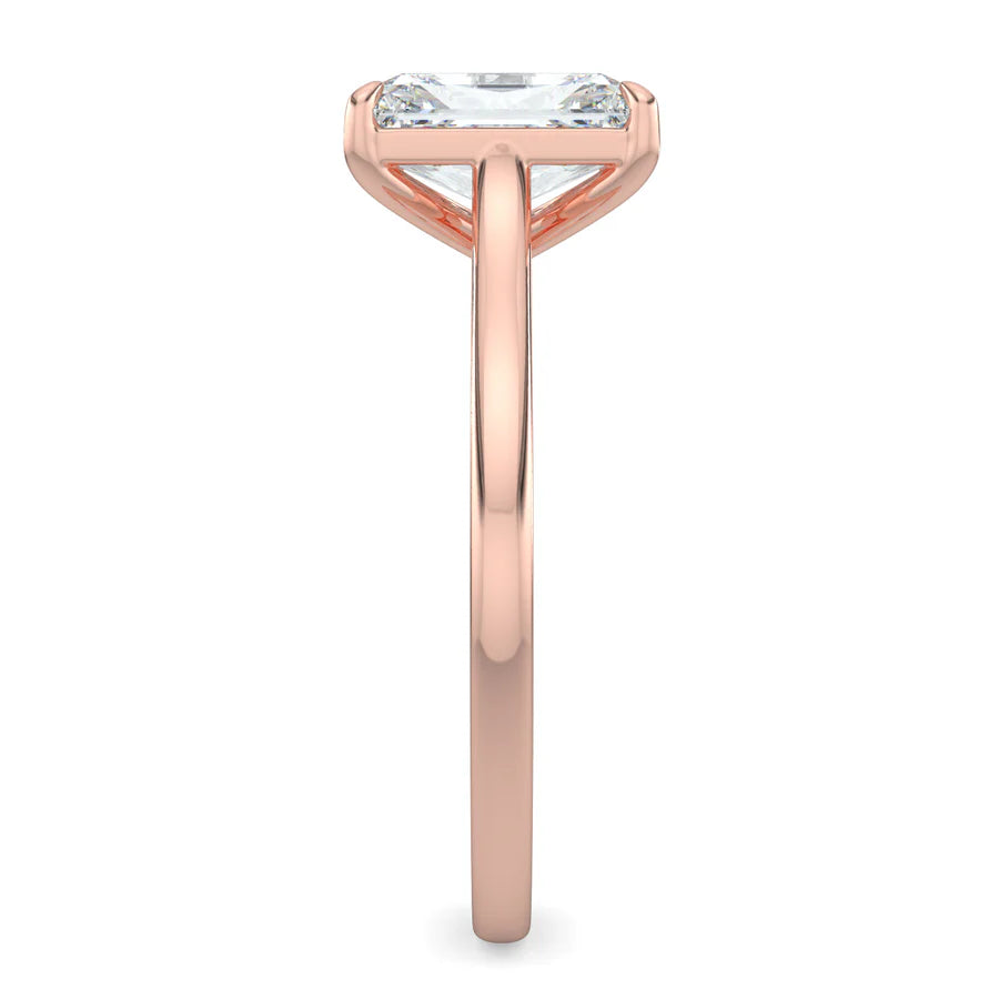 Side view of a rose gold lab diamond ring featuring a polished band and a larger central diamond in a four-prong setting.