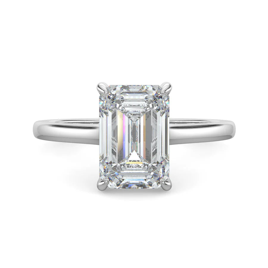 Top view of a silver lab grown diamond ring with radiant-cut diamond in a four-prong setting and silver color polished band.