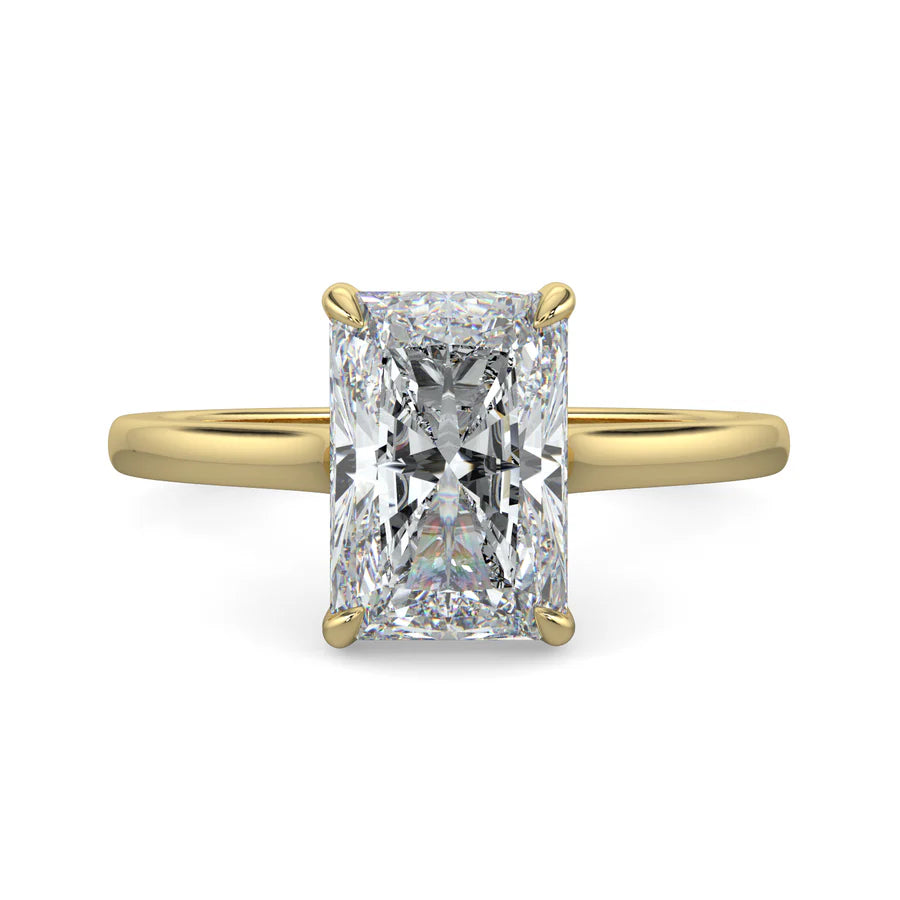 Top view of a lab diamond ring in yellow gold featuring a larger central diamond of round brilliant cut in a four-prong setting.