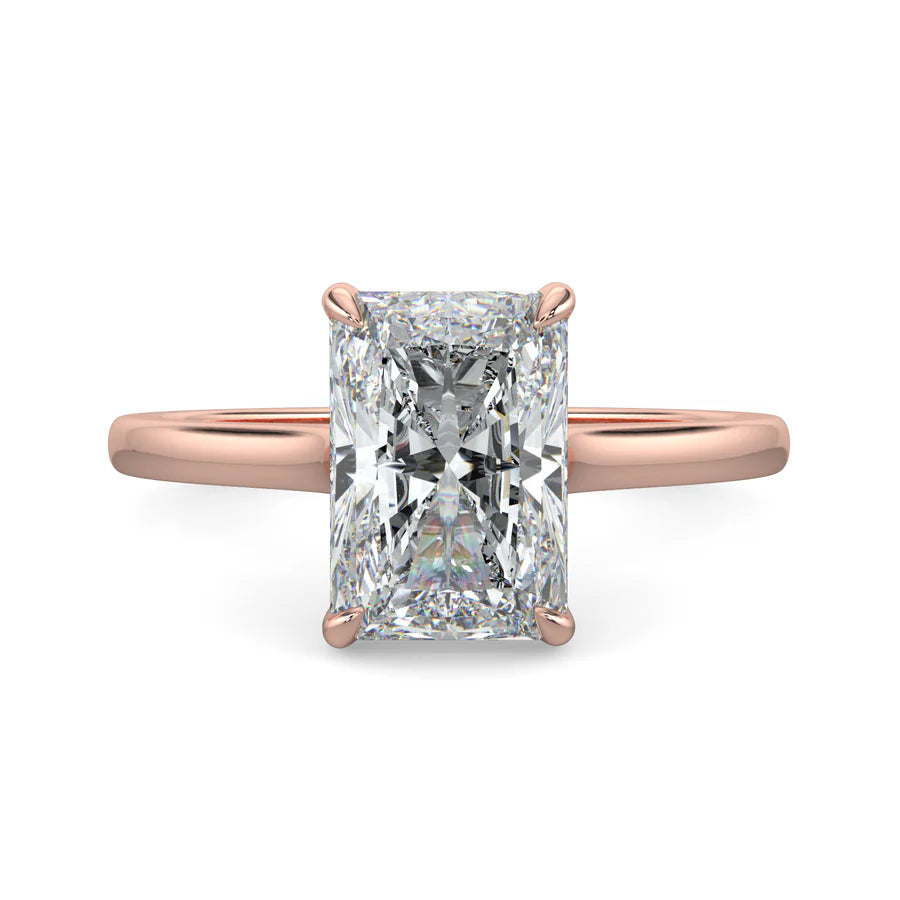 Top view of a rose gold lab diamond ring featuring a polished band and a larger central diamond of round cut in a four-prong setting.