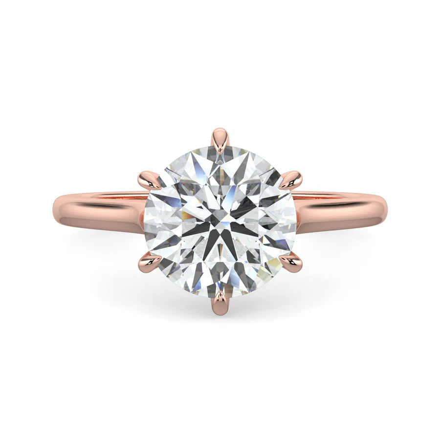 Side view of a rose gold engagement ring featuring a sleek white gold band with 8 prongs.