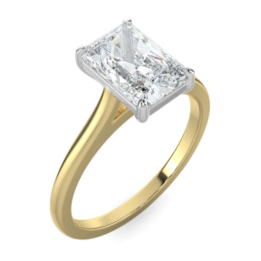 Angled view of lab diamond ring in yellow gold, featuring a white diamond held securely by four prongs.