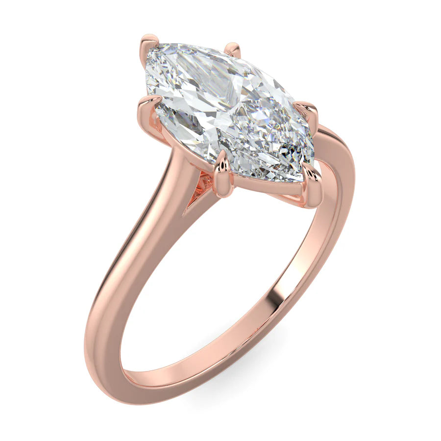 Angled view of rose gold lab diamond ring featuring a larger central diamond in six prong setting.