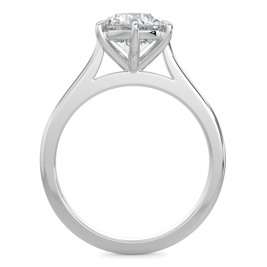 Top view of a cathedral-style solitaire engagement ring in white gold, showcasing a round white diamond secured by three prongs. 