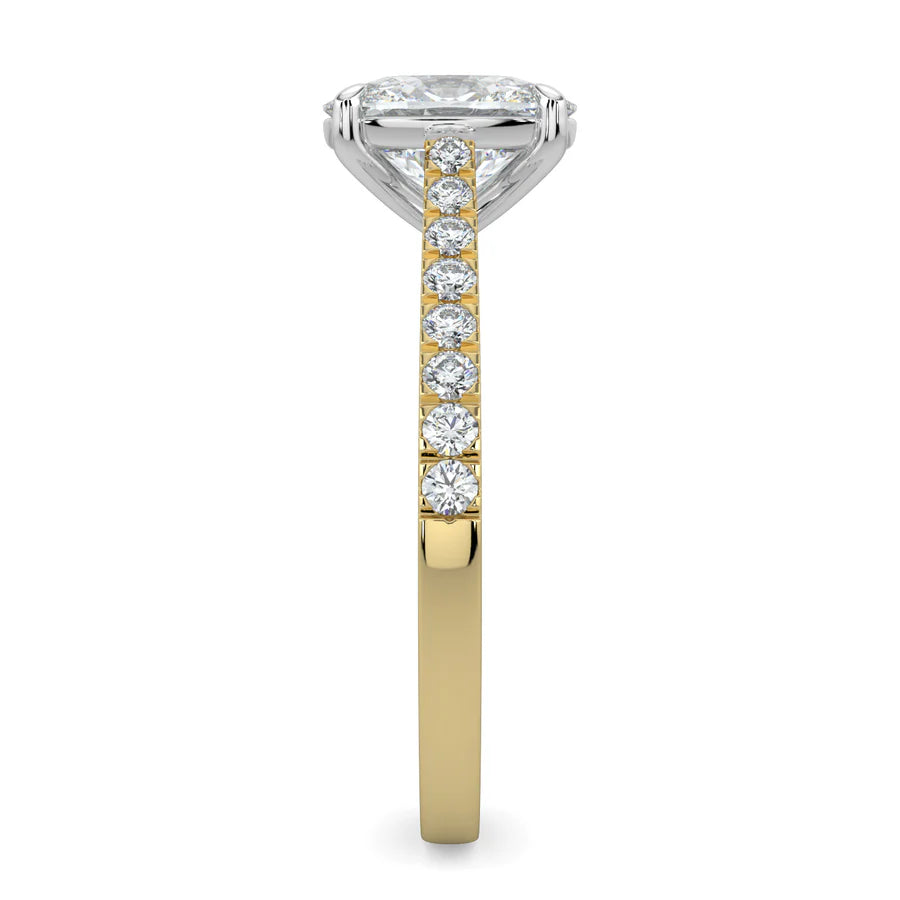 Side view of a gold lab diamond ring featuring small diamonds on the band and a larger central diamond of oval shape in silver color four prong setting.