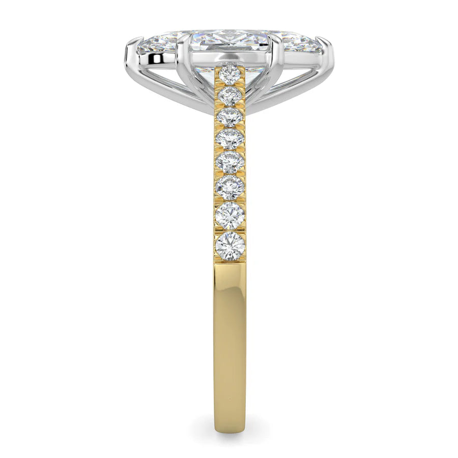 Side view of a gold lab diamond ring featuring small diamonds on the band and a larger central diamond of pear shape in silver color six prong setting.