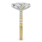 Side view of a gold lab diamond ring featuring small diamonds on the band and a larger central diamond of pear shape in silver color six prong setting.