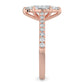 Side view of a rose gold lab diamond ring featuring small diamonds on the band and a larger central diamond of pear shape in six prong setting.
