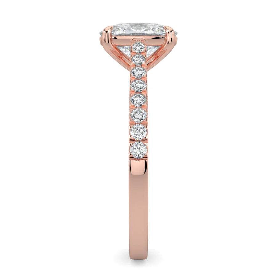 Side view of a rose gold lab diamond ring featuring small diamonds on the band and a larger central diamond in six prong setting.