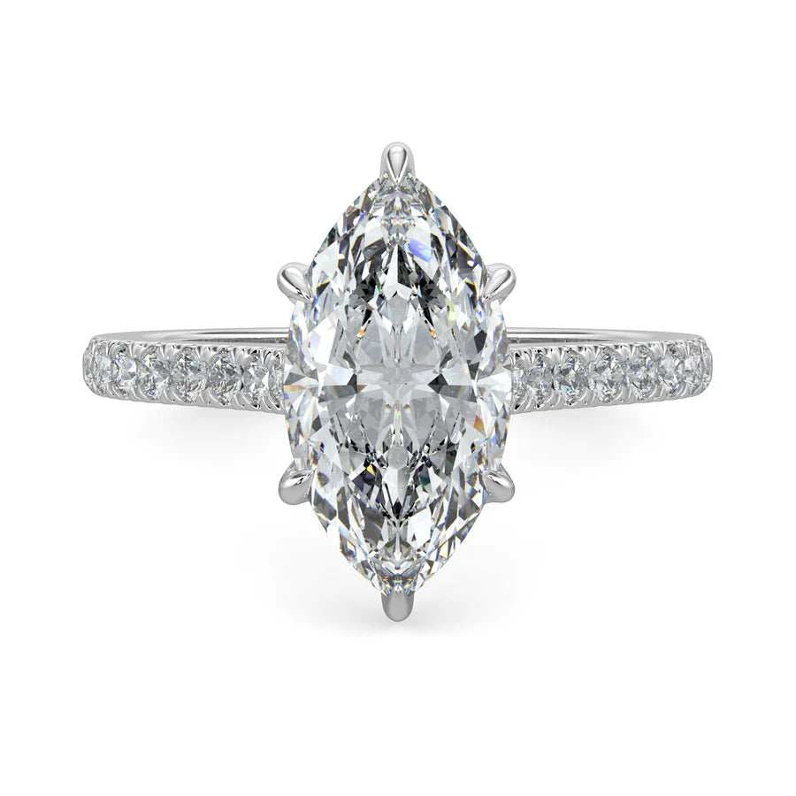 A silver lab diamond ring featuring small diamonds on the band and a larger central diamond of pear shape in six prong setting.