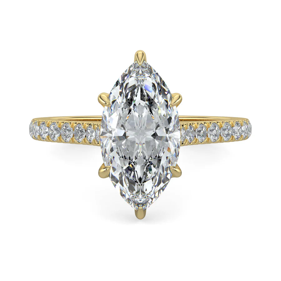 A gold lab diamond ring featuring small diamonds on the band and a larger central diamond of pear shape in six prong setting.