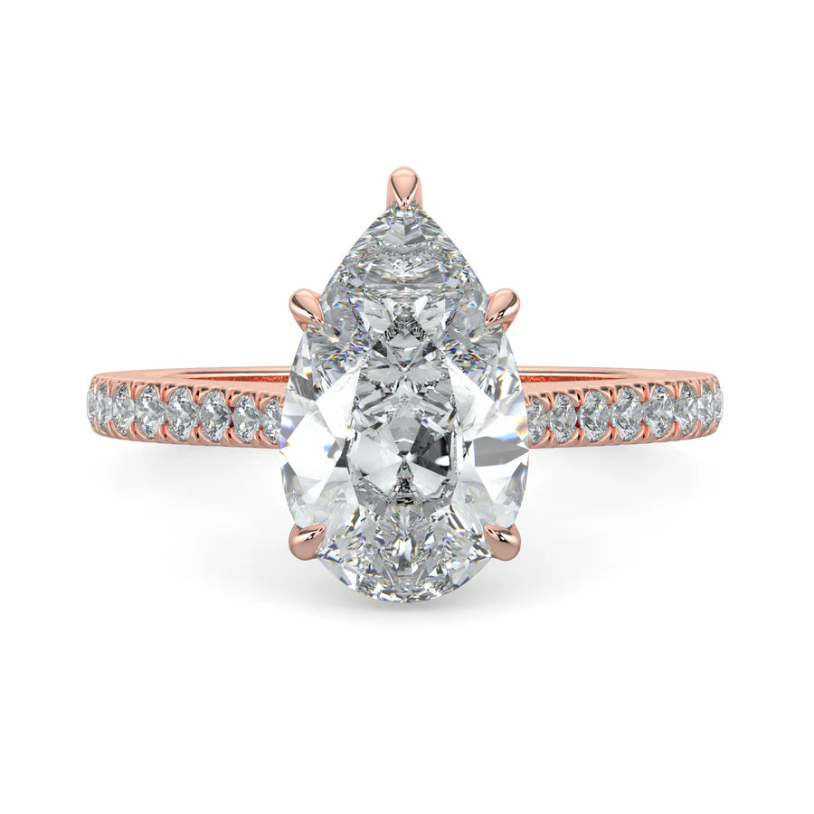 A pear shaped lab diamond ring in rose gold color featuring small diamonds on the band and a larger central diamond in five prong setting.