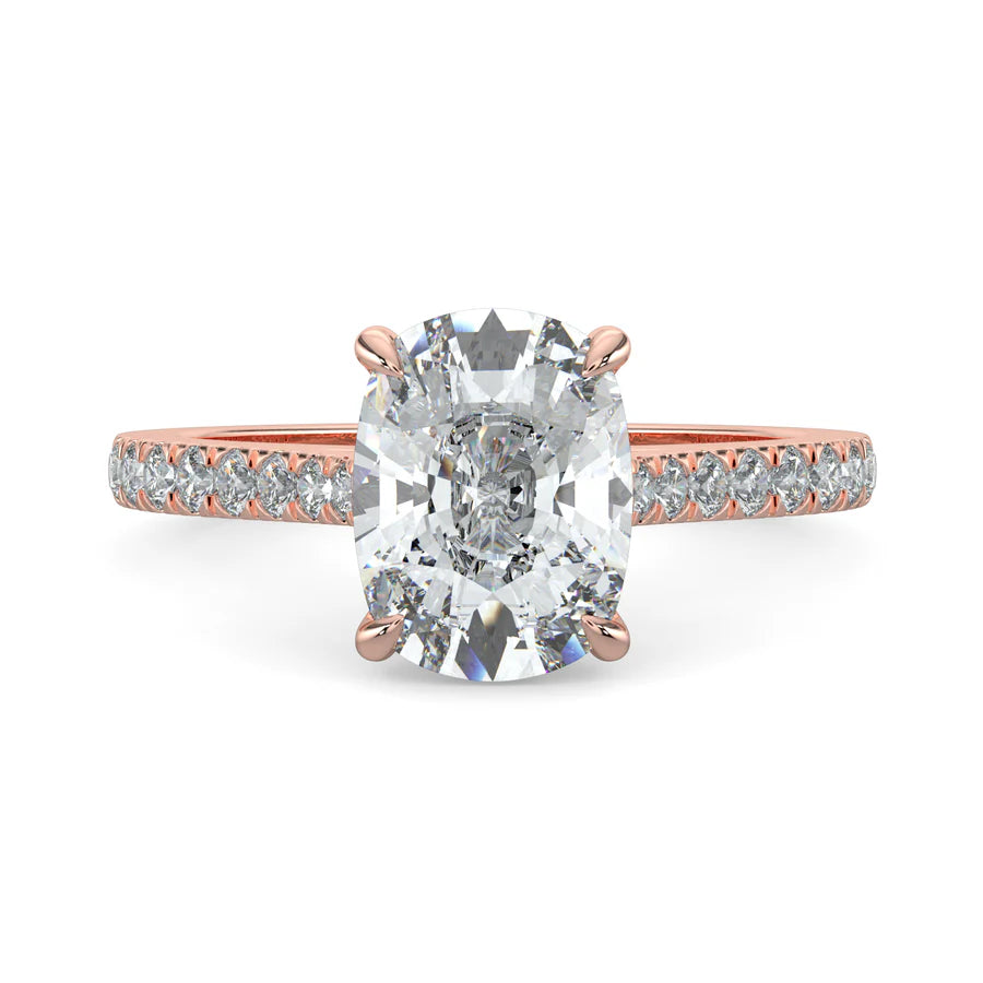 A rose gold lab diamond ring featuring small diamonds on the band and a larger central diamond of oval shape in four prong setting.