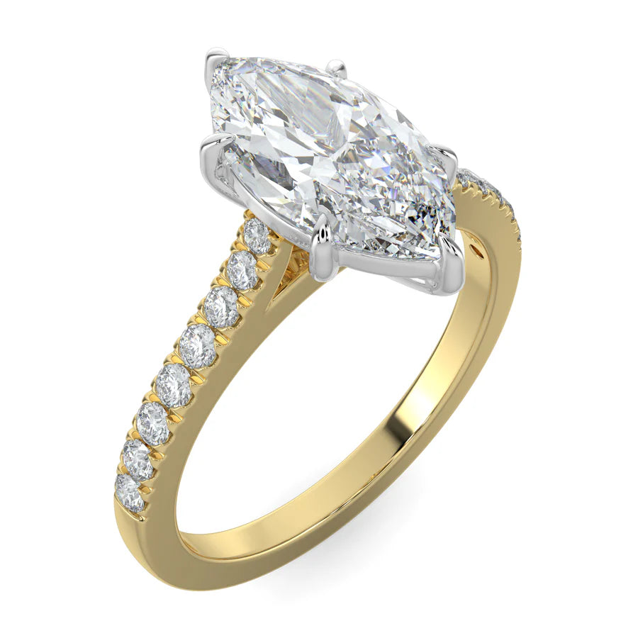 Angled view of a gold lab diamond ring featuring small diamonds on the band and a larger central diamond of pear shape in silver color six prong setting.