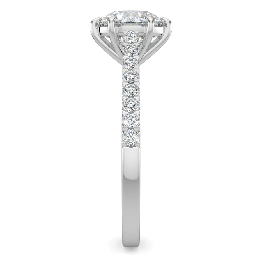 Side view of a round lab diamond ring in silver color featuring small diamonds on the band and a larger central diamond in six prong setting.