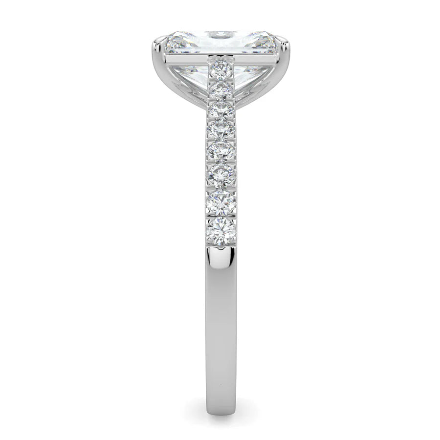 Side view of a silver lab diamond ring featuring small diamonds on the band and a larger central diamond in silver color in four prong setting.