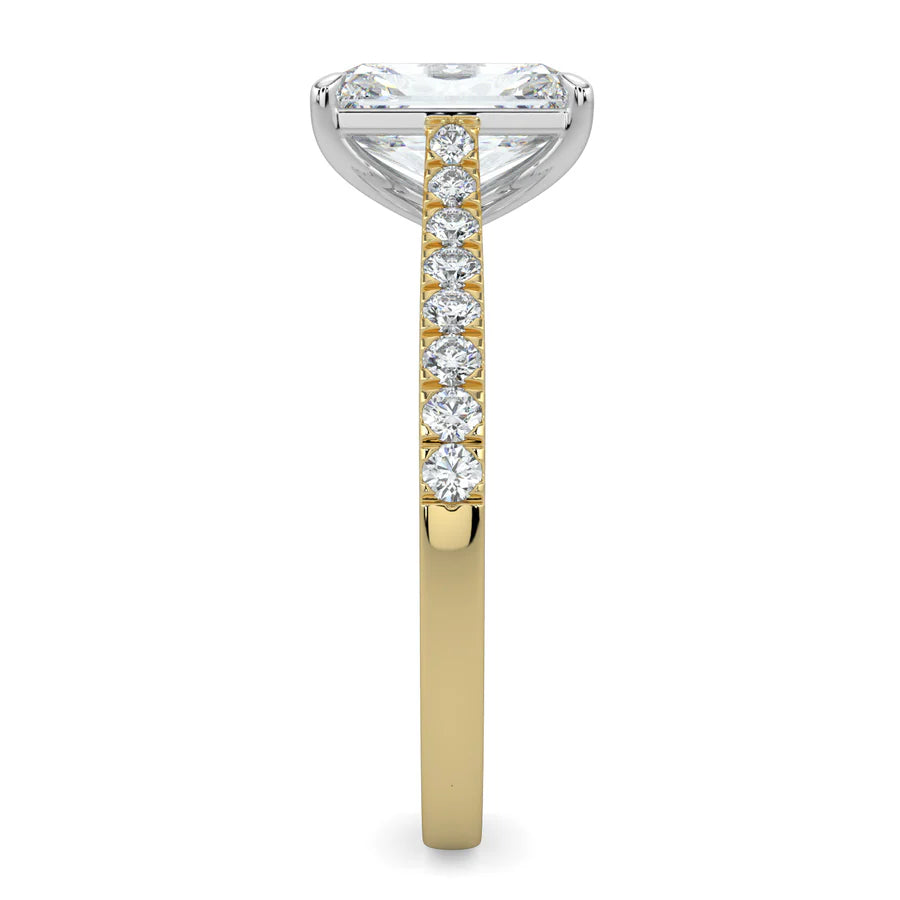 Side view of a gold lab diamond ring featuring small diamonds on the band and a larger central diamond in  in silver color four prong setting.