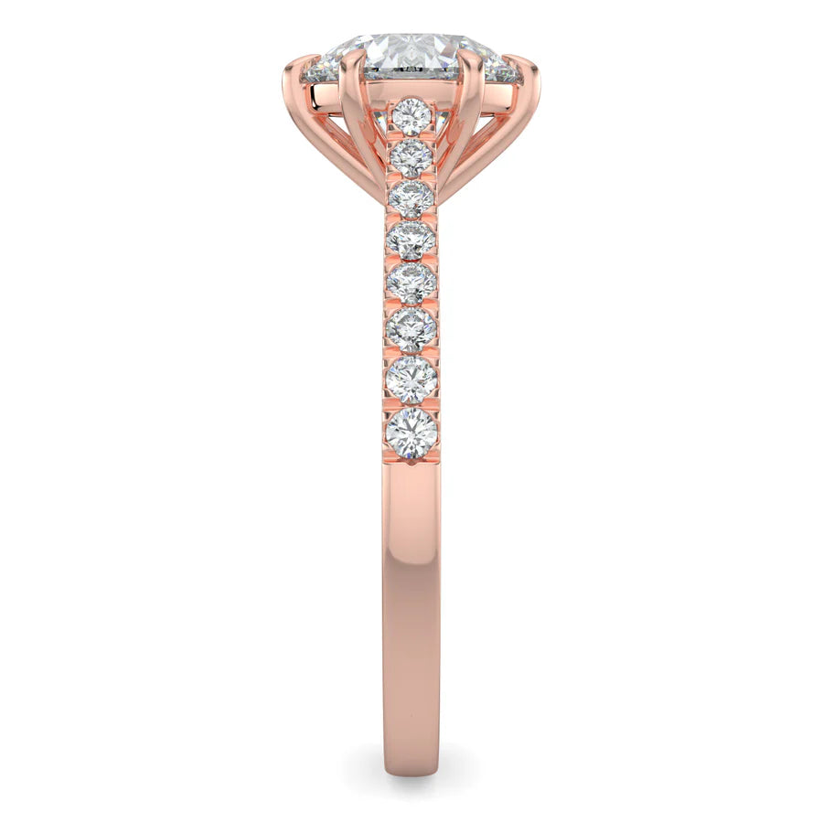 Side view of a round lab diamond ring in rose gold color featuring small diamonds on the band and a larger central diamond in six prong setting.