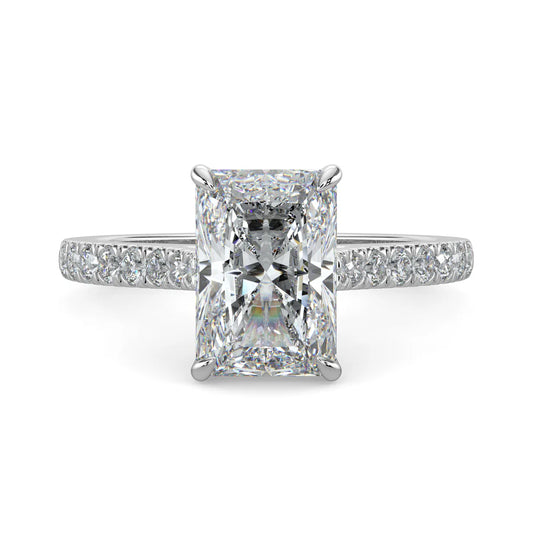 Silver color lab diamond ring featuring small diamonds on the band and a larger square shaped central diamond in four prong setting.