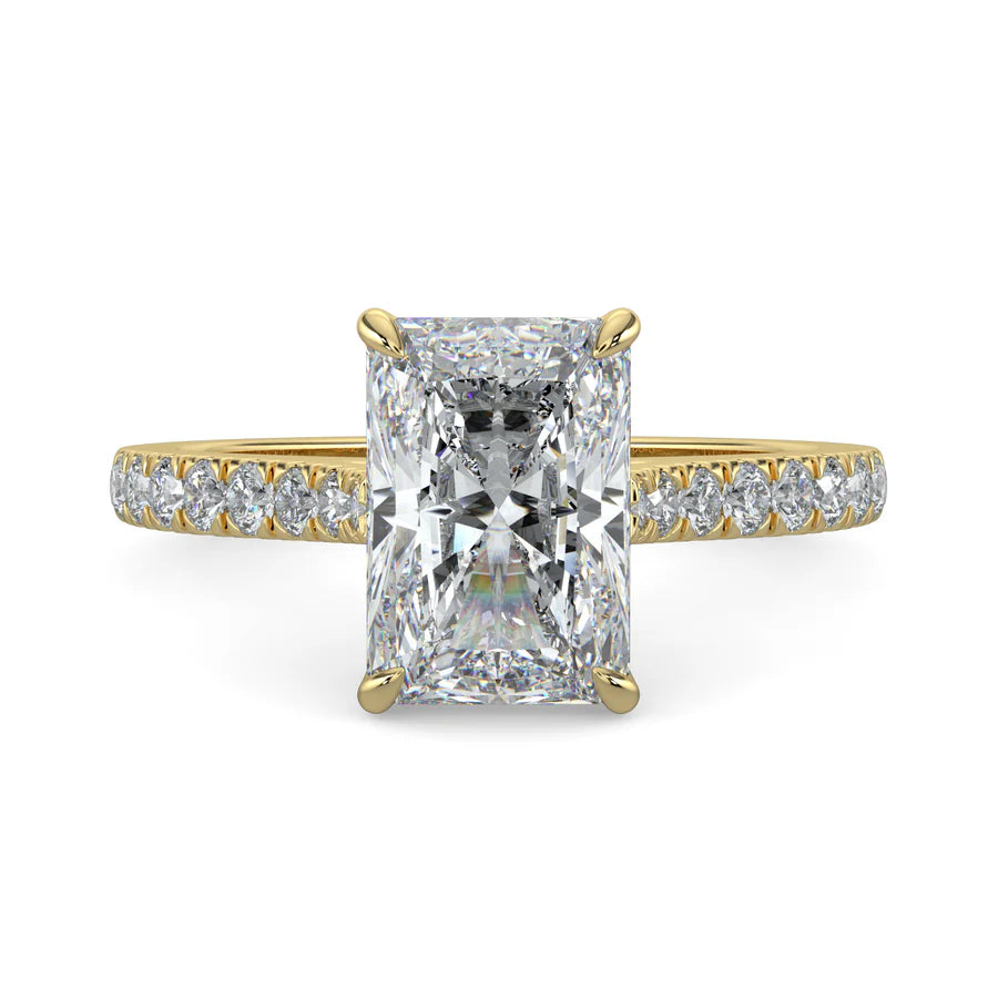 Gold color lab diamond ring featuring small diamonds on the band and a larger square shaped central diamond in  in four prong setting.