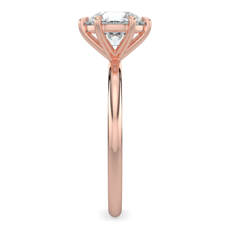 Side view of rose gold lab diamond ring featuring a diamond on polished band in four setting.