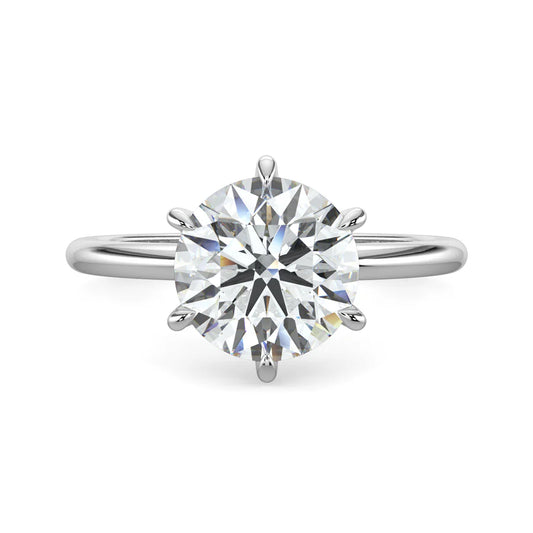 Top view of silver lab diamond ring featuring a diamond on round polished band in six prong setting.