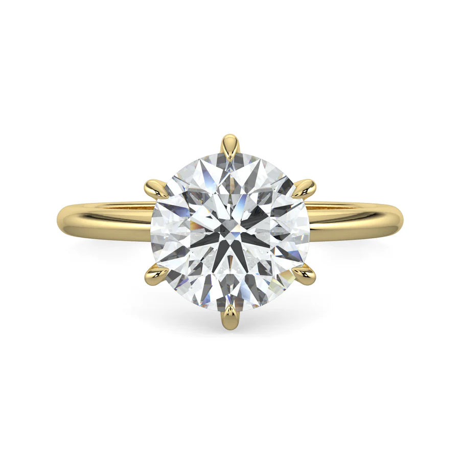 Top view of yellow lab diamond ring featuring a diamond on round polished band in six prong setting.