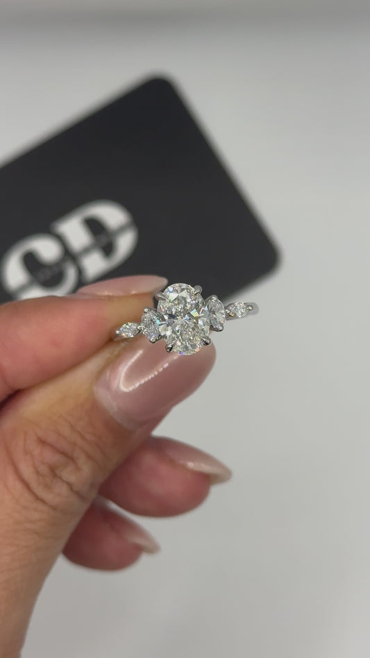 Oval accented side stone lab engagement ring