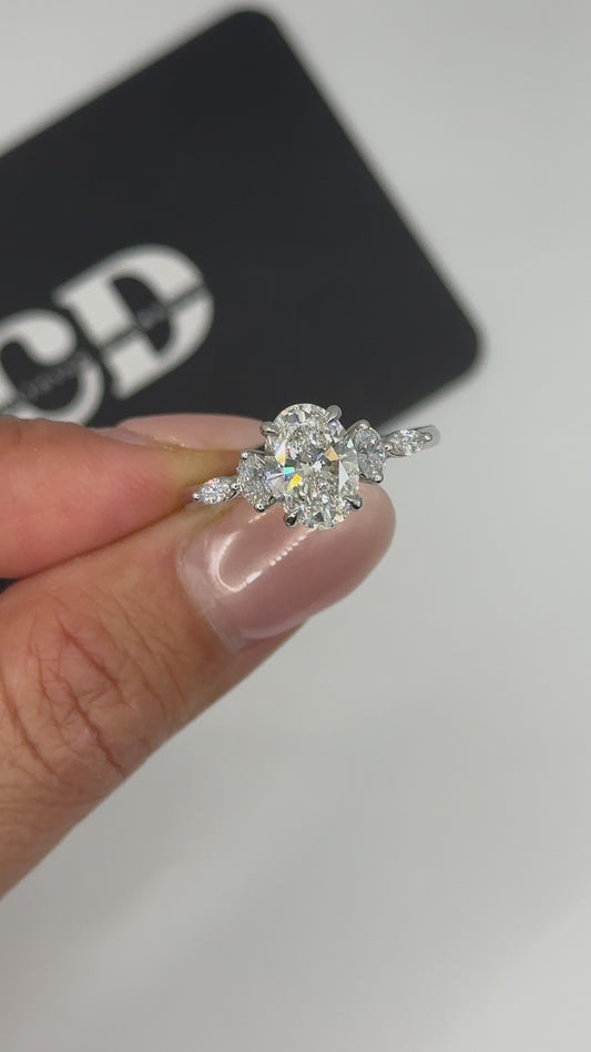 Oval accented side stone lab engagement ring